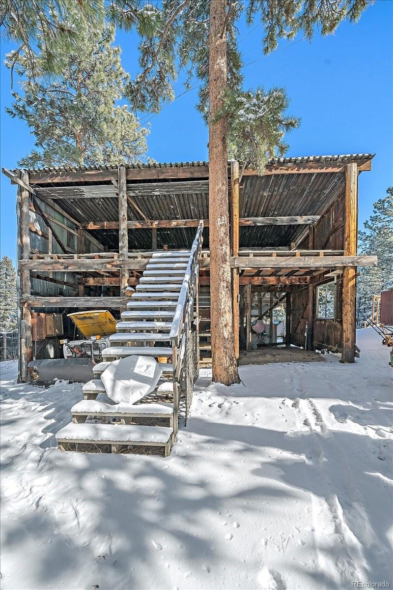 4551 Hilltop Road Evergreen, CO 80439 - Photo 18 of 30 a view of street along with trees