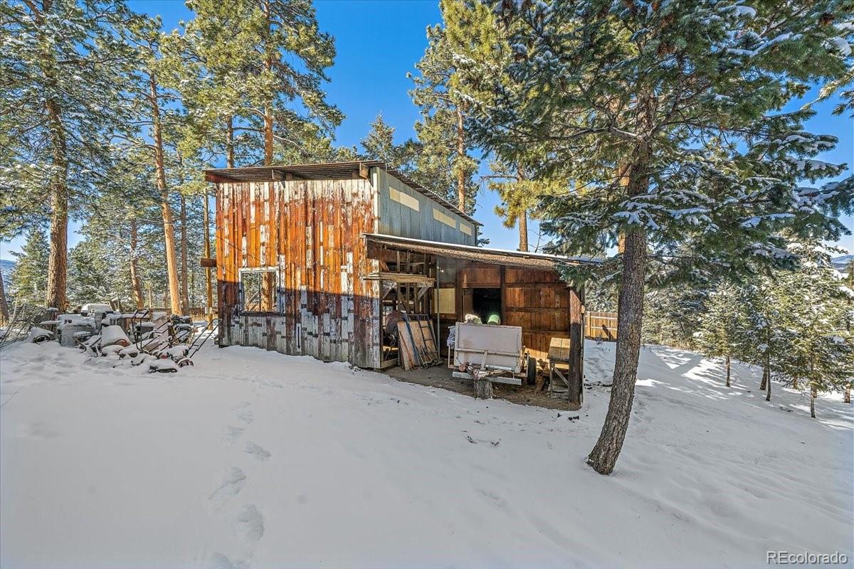4551 Hilltop Road Evergreen, CO 80439 - Photo 19 of 30 a view of outdoor space and patio