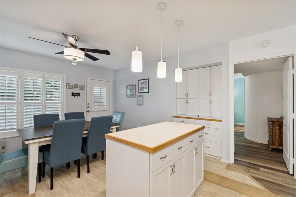 2291 Americus Boulevard West, Unit 3 Clearwater, FL 33763 - Photo 17 of 88 a view of kitchen with cabinets and wooden floor