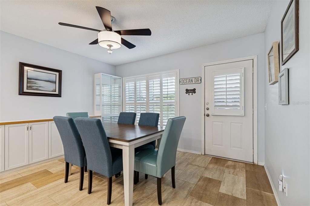 2291 Americus Boulevard West, Unit 3 Clearwater, FL 33763 - Photo 19 of 88 a view of a dining room with furniture