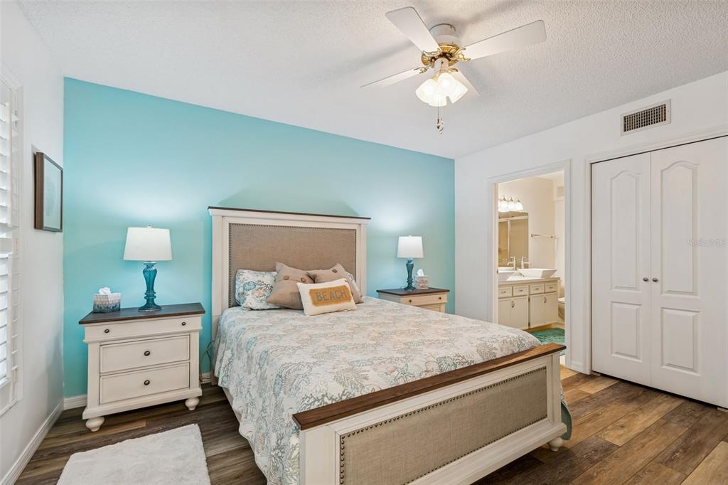 2291 Americus Boulevard West, Unit 3 Clearwater, FL 33763 - Photo 25 of 88 a bedroom with a bed and a closet