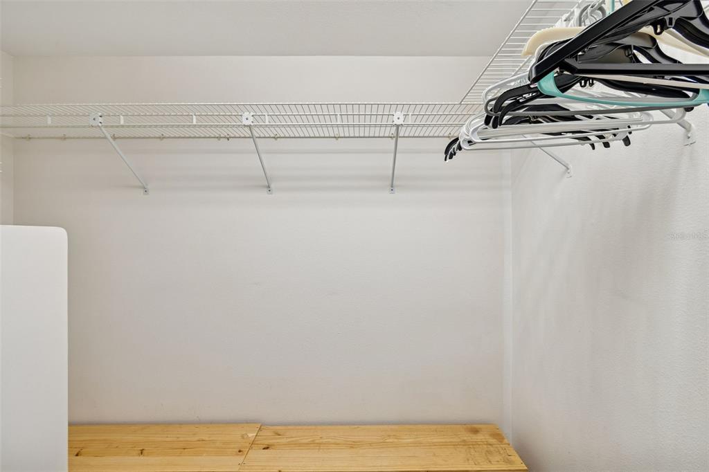 2291 Americus Boulevard West, Unit 3 Clearwater, FL 33763 - Photo 27 of 88 a view of a room with racks on the wall