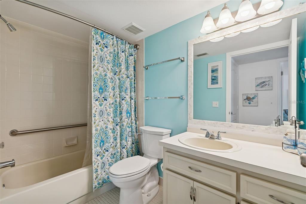 2291 Americus Boulevard West, Unit 3 Clearwater, FL 33763 - Photo 38 of 88 a bathroom with a sink toilet and shower