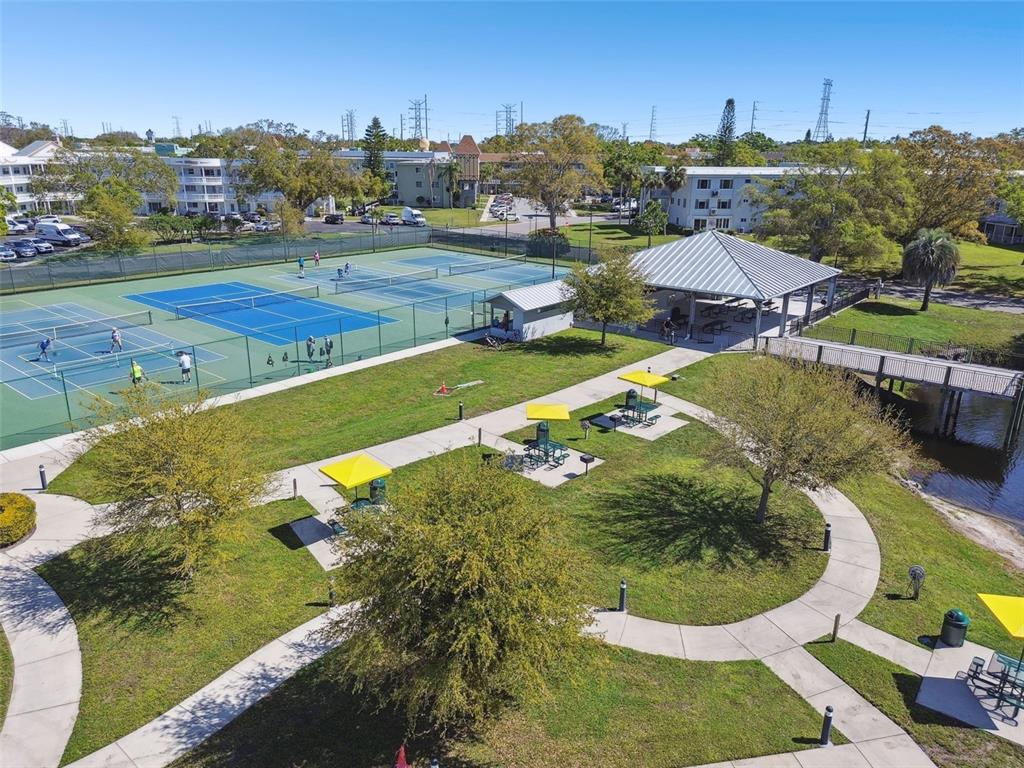 2291 Americus Boulevard West, Unit 3 Clearwater, FL 33763 - Photo 49 of 88 a view of a swimming pool with a yard