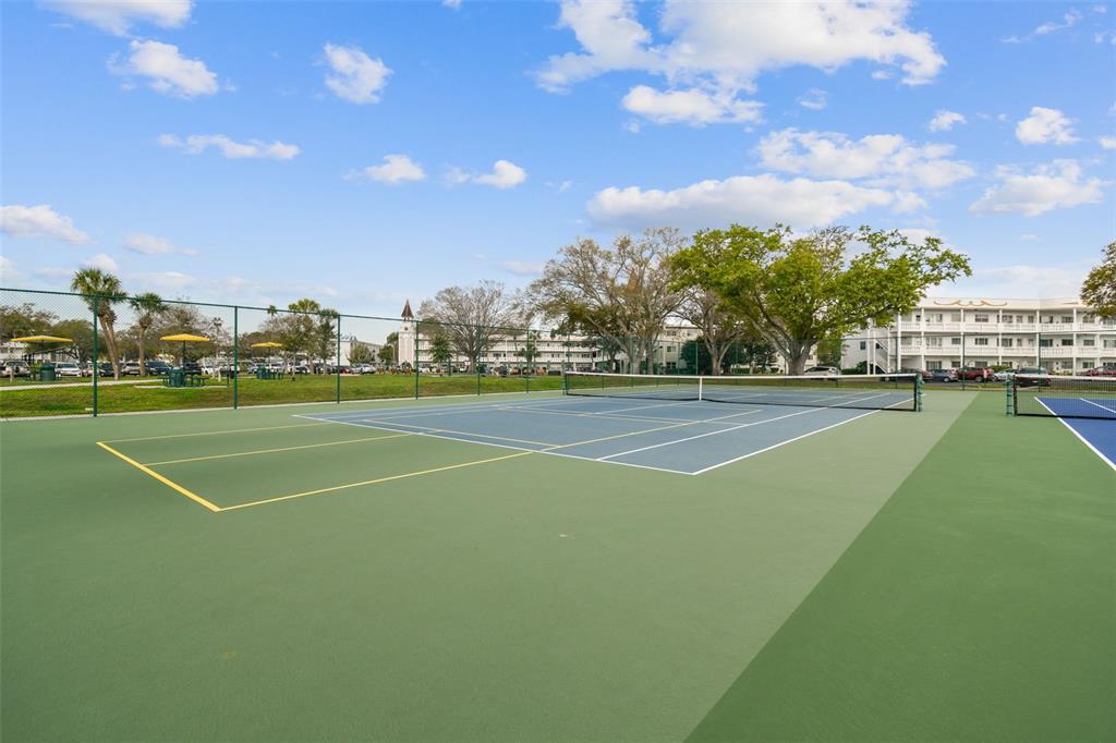 2291 Americus Boulevard West, Unit 3 Clearwater, FL 33763 - Photo 61 of 88 a view of a tennis court