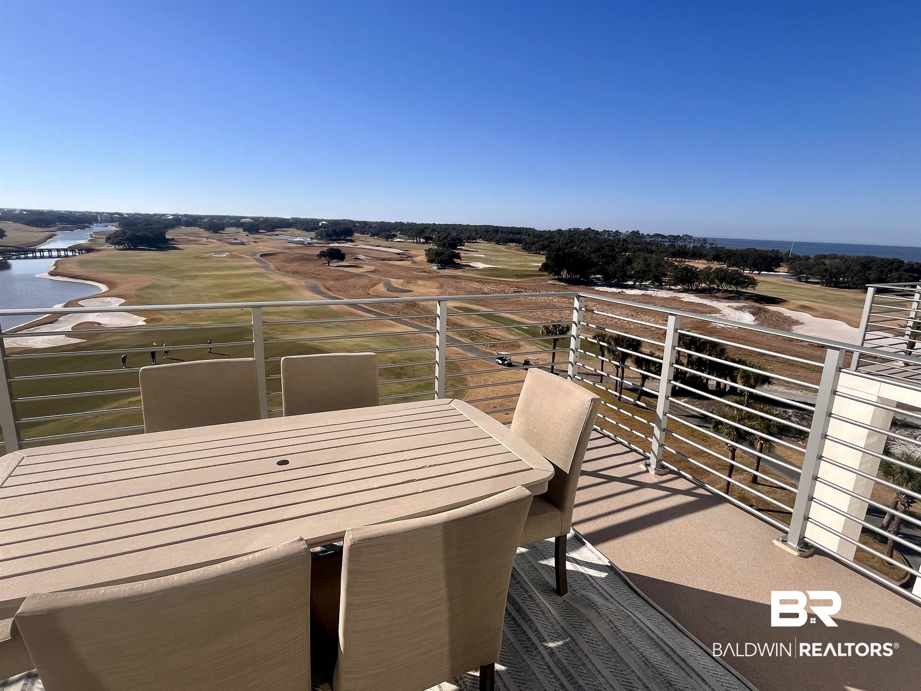 815 Plantation Road, Unit 604 Gulf Shores, AL 36542 - Photo 15 of 86 Balcony with golf course view, a water view, and outdoor dining area
