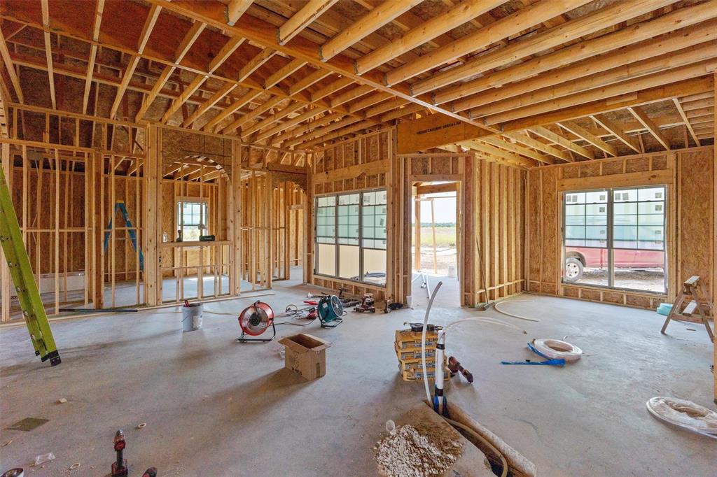 1405 Red Rock Road Hewitt, TX 76643 - Photo 25 of 25 Interior framing showcasing open floor plan, multiple windows, and exposed ceiling joists
