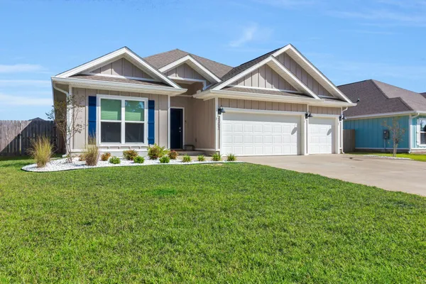 a front view of a house with a yard and porch
