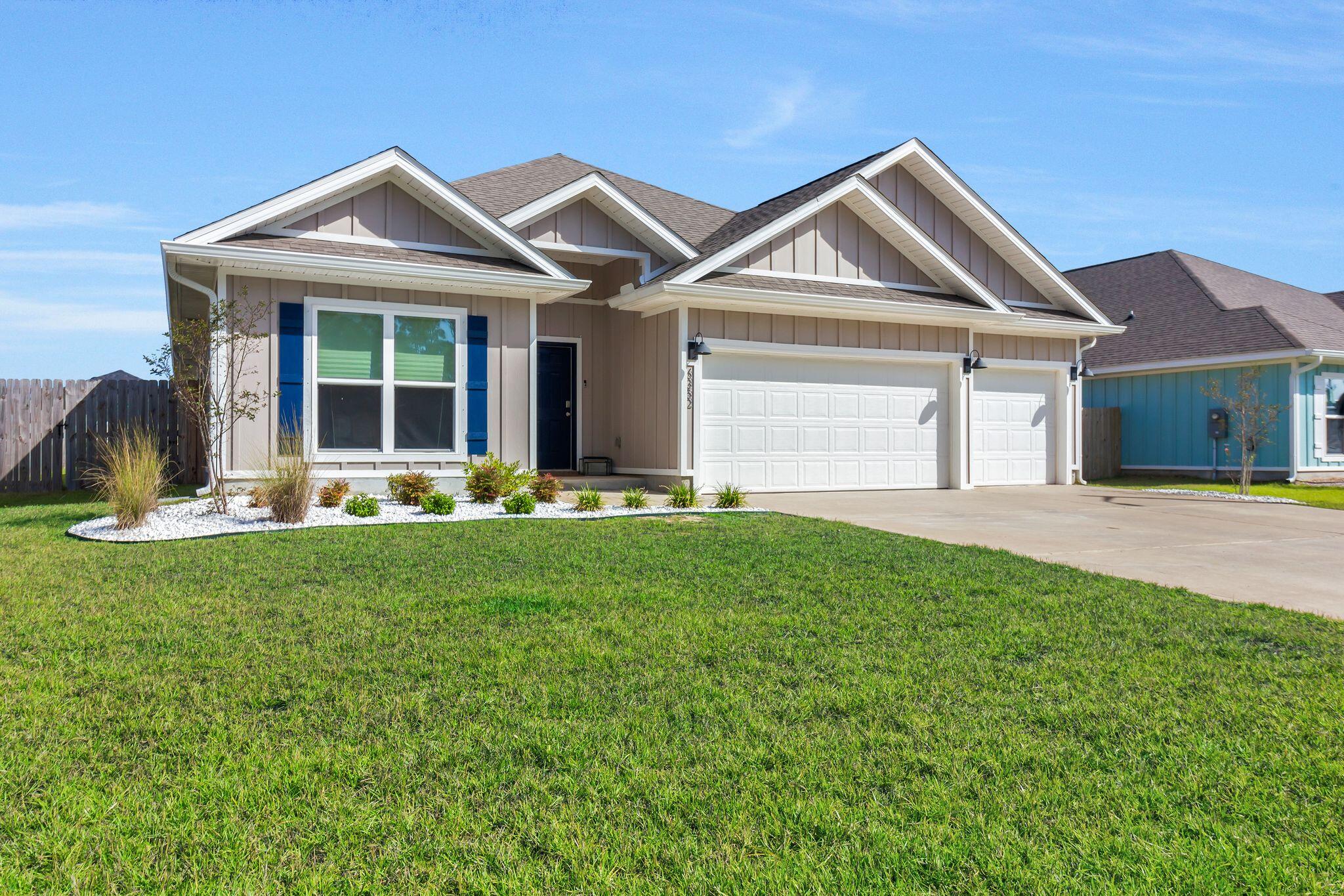 a front view of a house with a yard and porch