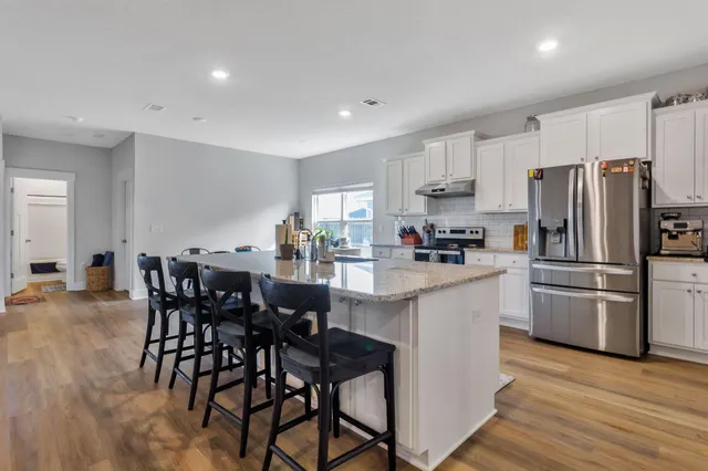 a view of hallway with wooden floor