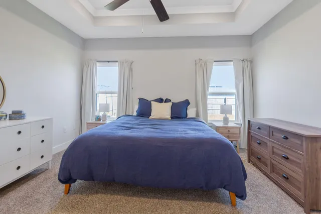 a spacious bathroom with a granite countertop sink mirror and shower