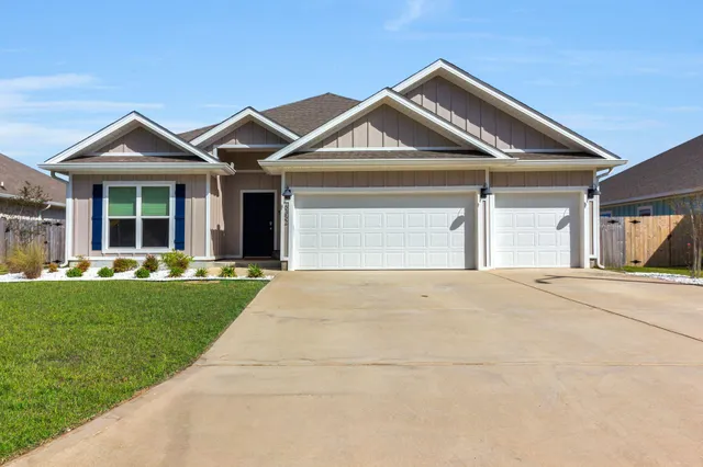 a front view of a house with yard