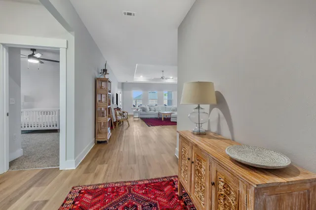 a view of room with furniture and wooden floor