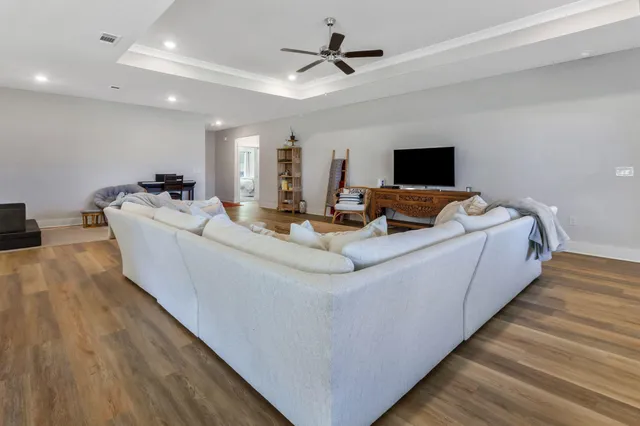 a kitchen with a table chairs microwave and cabinets
