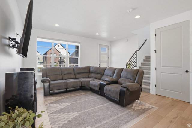 11531 Engelmann Drive Draper, UT 84020 - Photo 6 of 31 Living space featuring wood-finish flooring, recessed lighting, and a modern staircase with open balusters