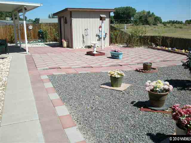 1672 Soda Lake Road Fallon, NV 89406 - Photo 4 of 9 a view of a backyard with plants and lake view