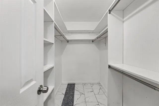 a view of an empty walk in closet