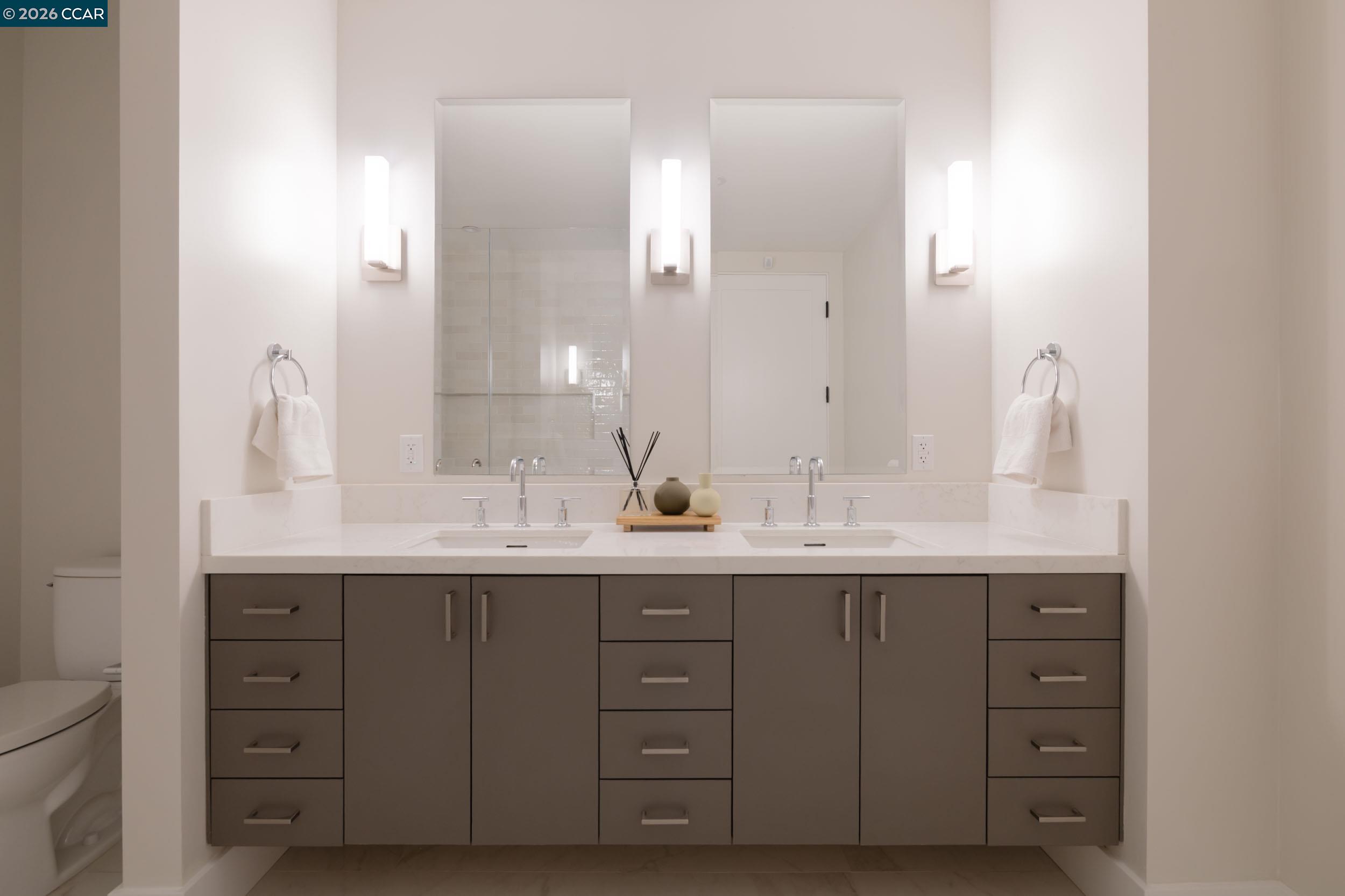 950 Hough Avenue, Unit 202 Lafayette, CA 94549 - Photo 19 of 38 a bathroom with double sink and a mirror