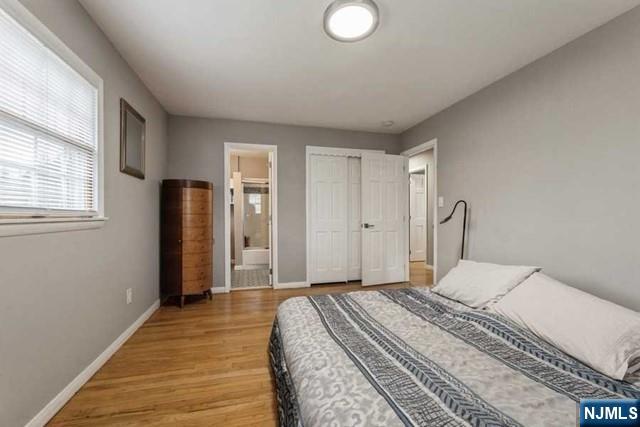 23 Asmus Road Closter, NJ 07624 - Photo 16 of 38 a bedroom with a bed and a window