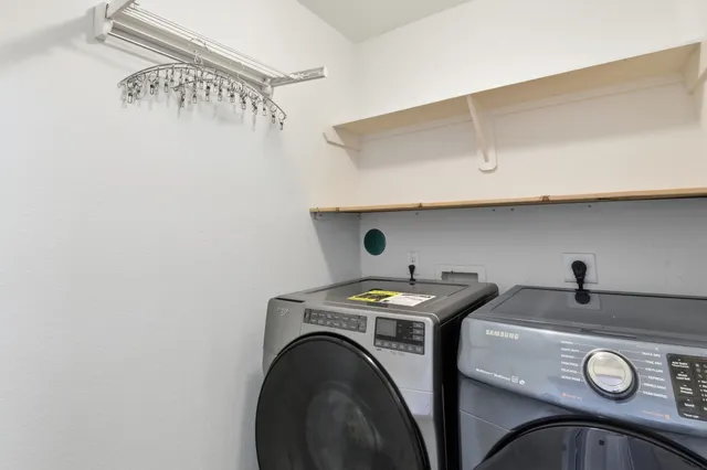 a view of a house with backyard and porch