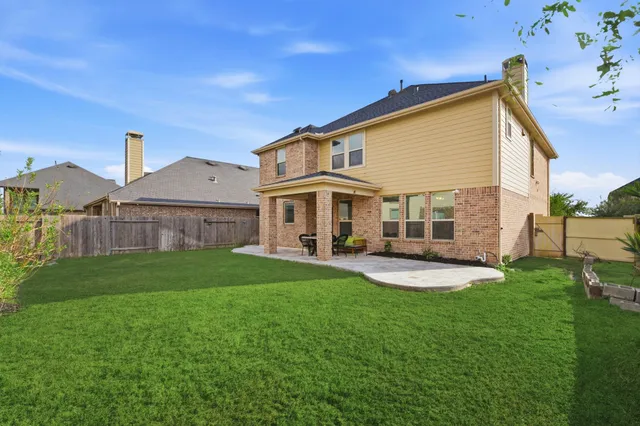 a view of a backyard of the house