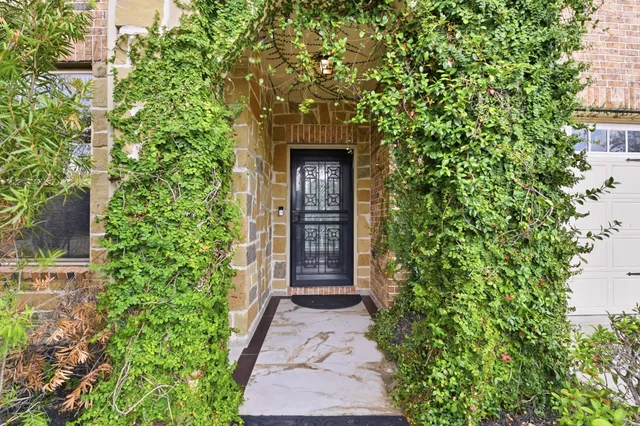 front view of a pathway both side of the house