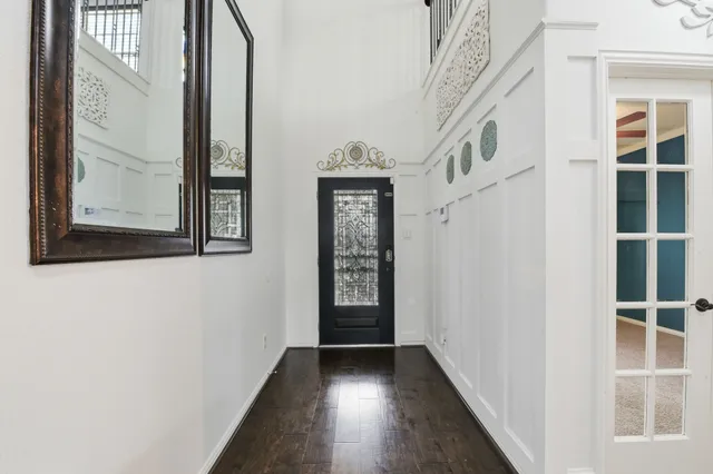 a view of an entryway with wooden floor