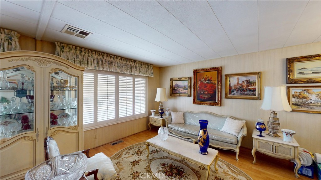 14851 Jeffrey Road, Unit 117 Irvine, CA 92618 - Photo 12 of 45 a living room with furniture and a window