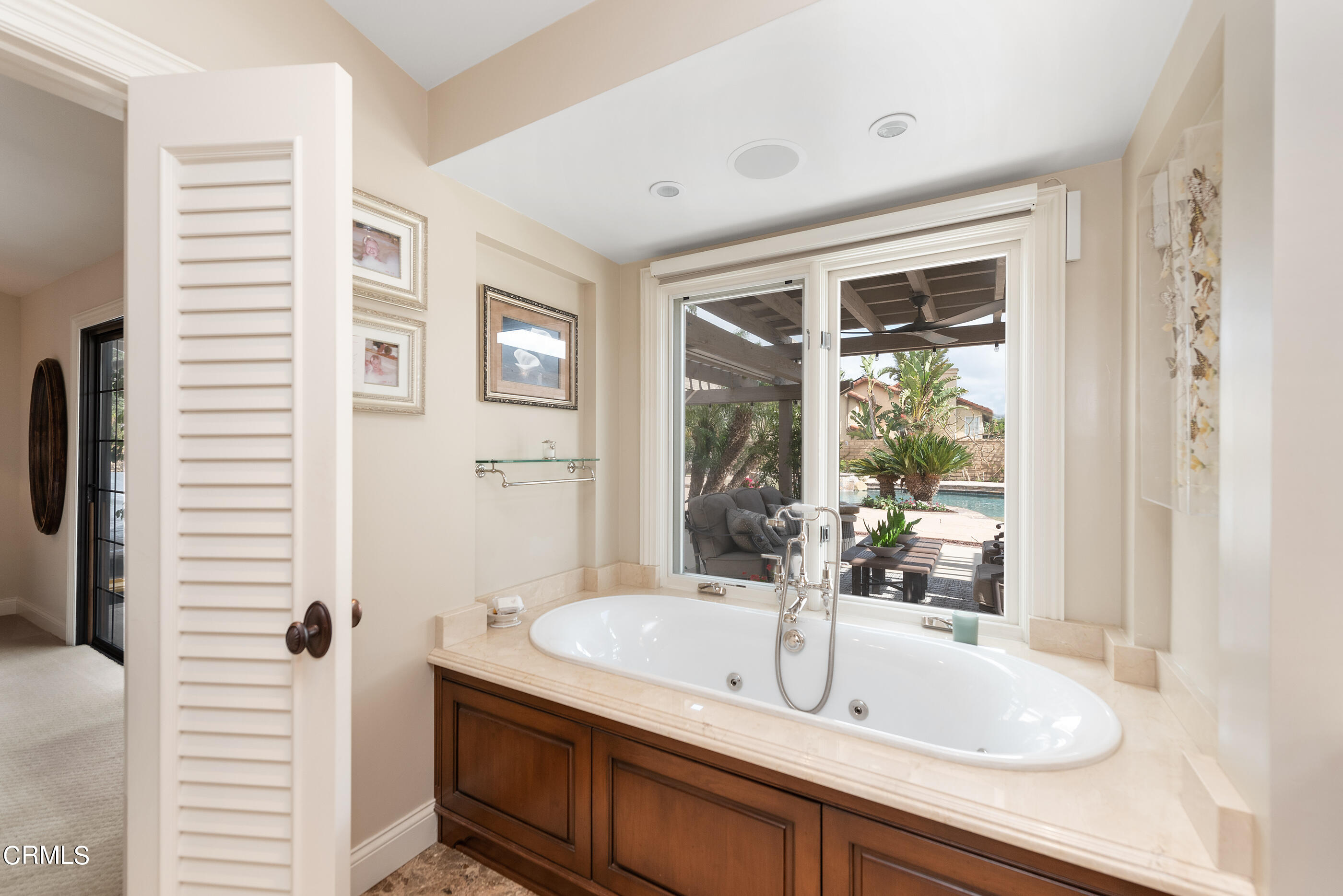 6893 Aviano Drive Camarillo, CA 93012 - Photo 28 of 67 a bathroom with a granite countertop sink and a mirror
