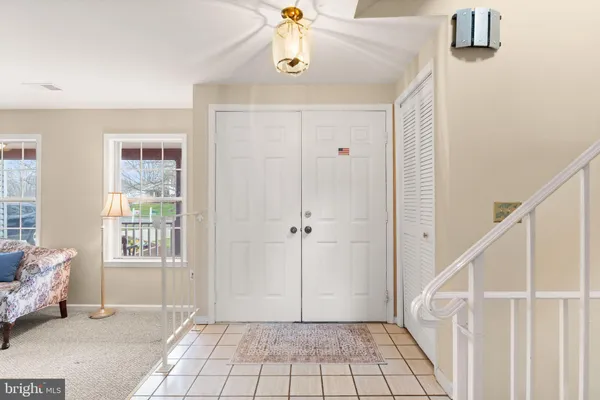 a dining room with furniture wooden floor a chandelier