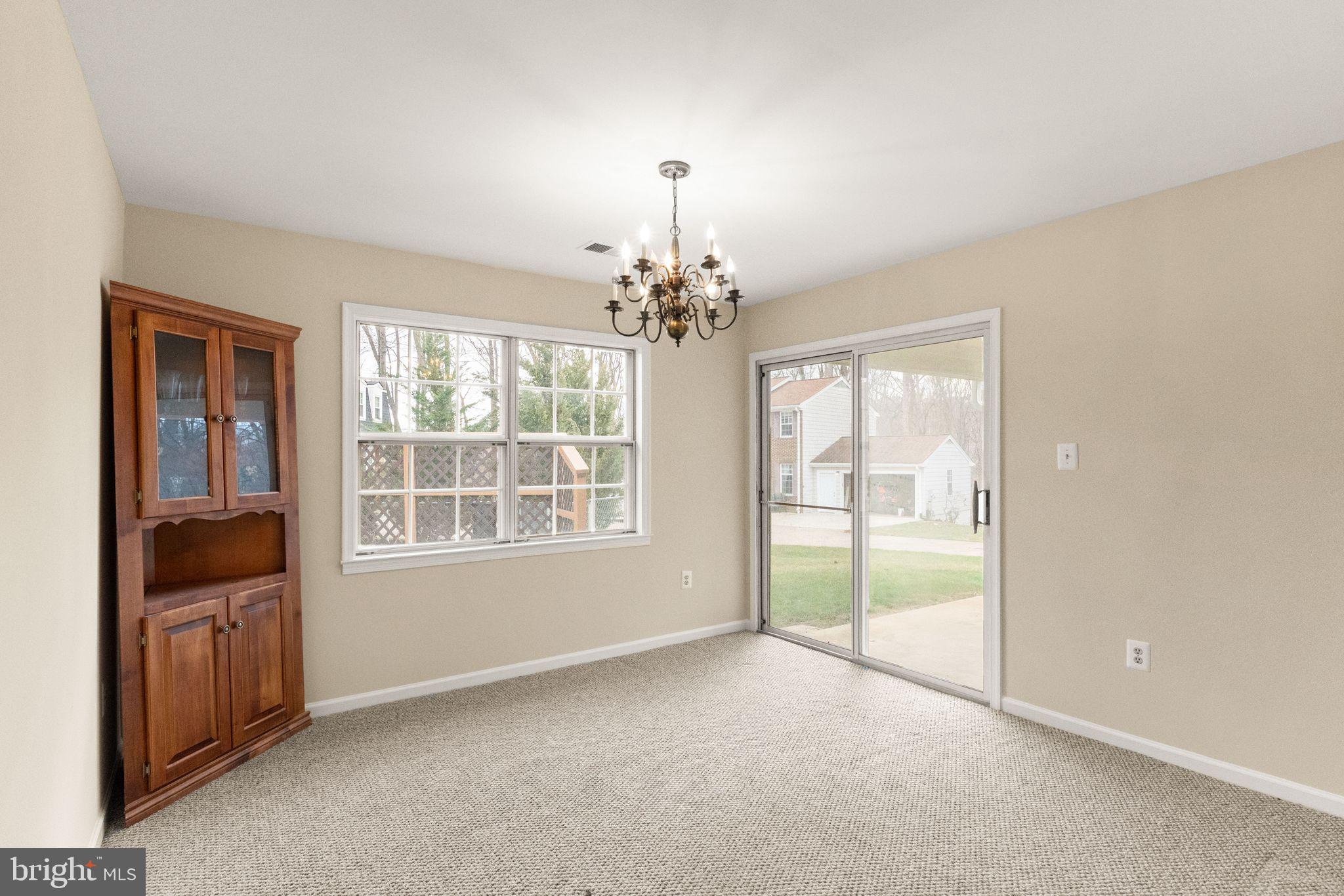 6027 Ridge Ford Drive Burke, VA 22015 - Photo 27 of 74 dining room with sliding door to patio