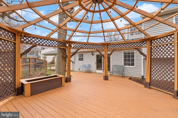 a front view of a house with a garden and yard