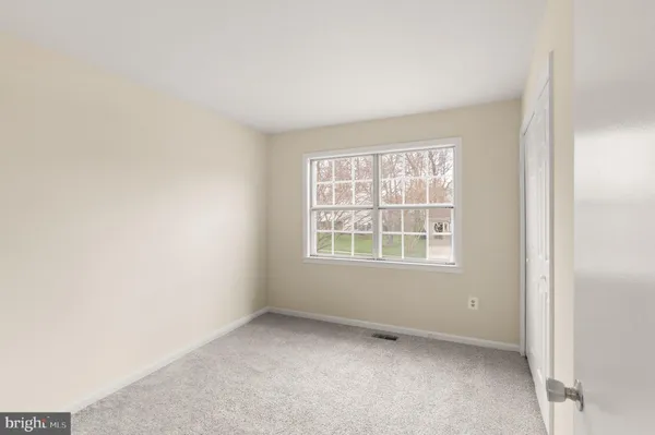 a view of a wooden deck with a yard