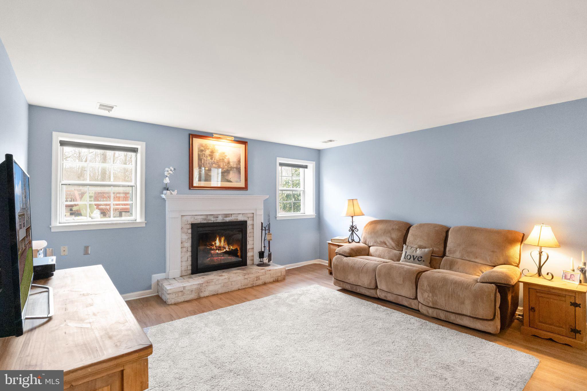 6027 Ridge Ford Drive Burke, VA 22015 - Photo 44 of 74 lower level family room with wood fireplace