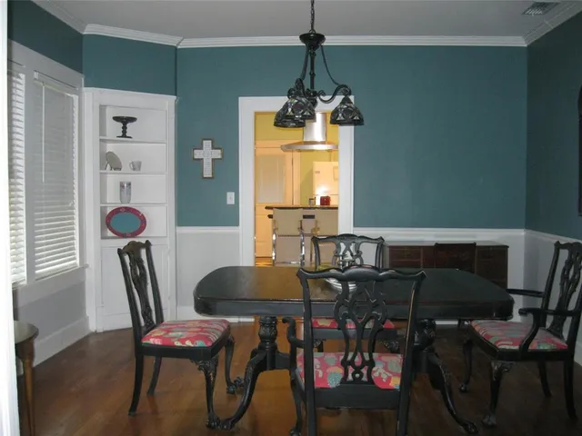 a view of a dining room with furniture and window