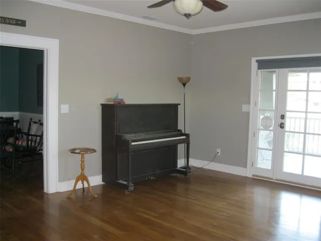 a view of room with window and wooden floor
