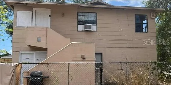 a view of a house with a street