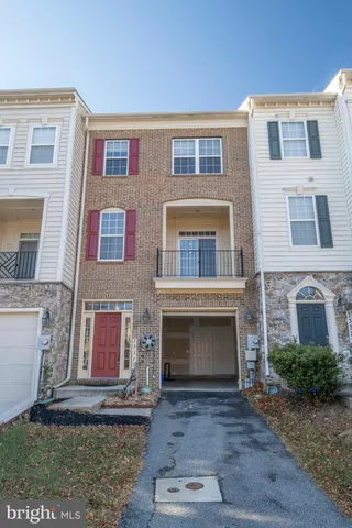 a front view of a house with yard