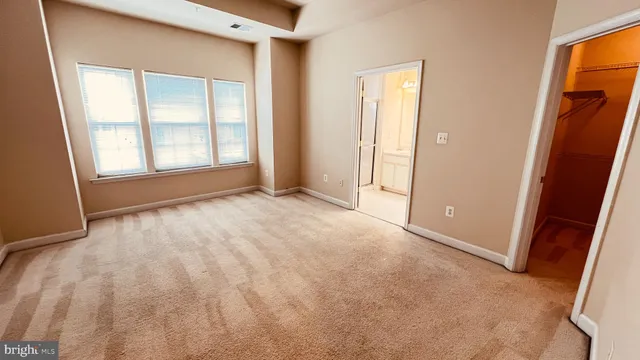 a bathroom with a double vanity sink mirror and shower