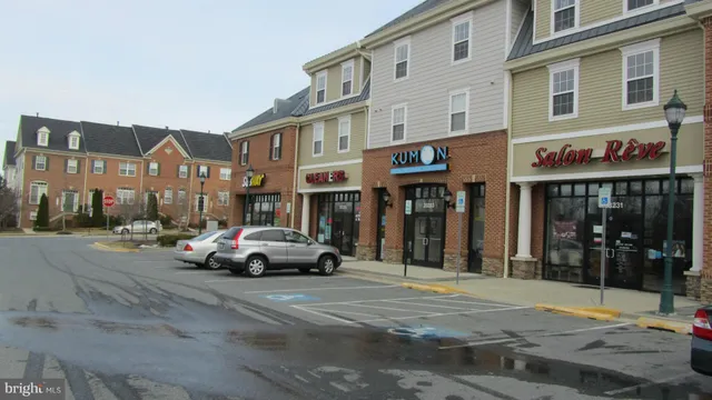 a view of a house with snow on the road