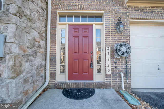 a view of a brick house with many windows