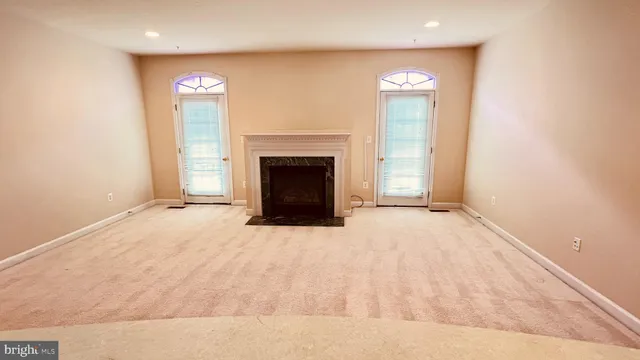 a view of a big room with closet and mirror