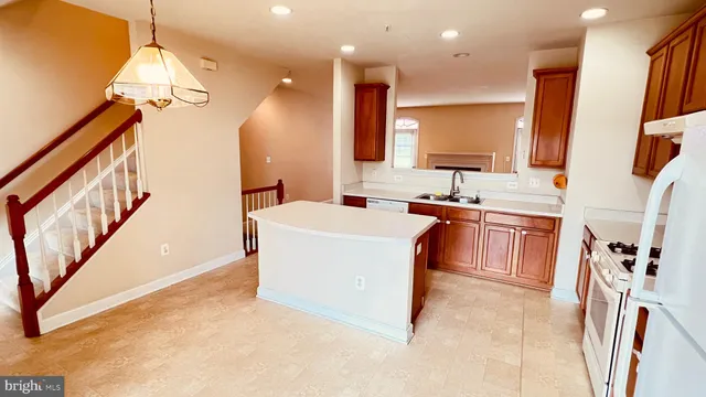 a white toilet sitting next to a bathroom sink