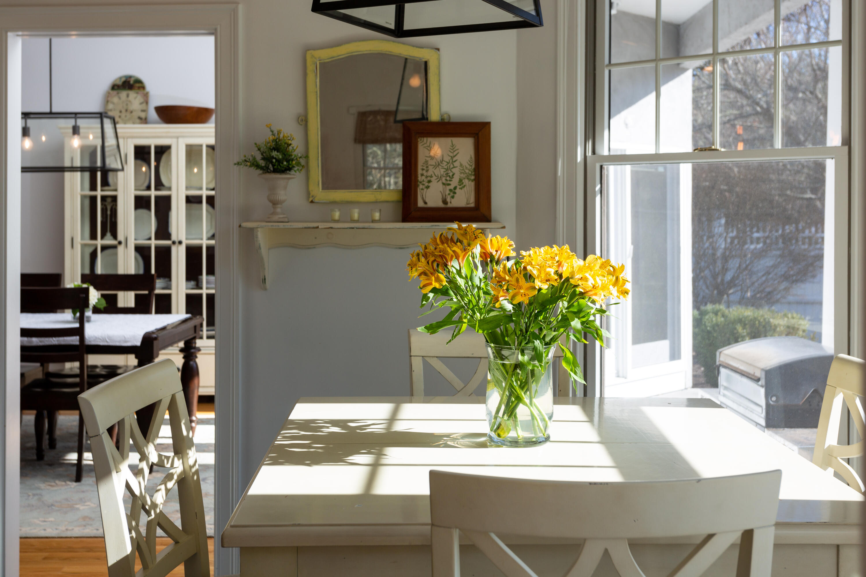 155 Baxter Neck Road Marstons Mills, MA 02648 - Photo 6 of 41 a vase of flowers sitting on a table with window