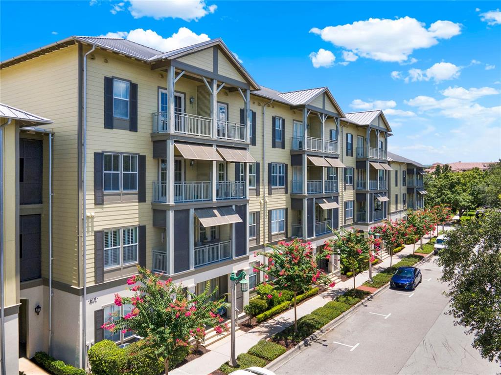 619 Front Street, Unit 3302 Celebration, FL 34747 - Photo 1 of 1 a view of a white building among the front of a house
