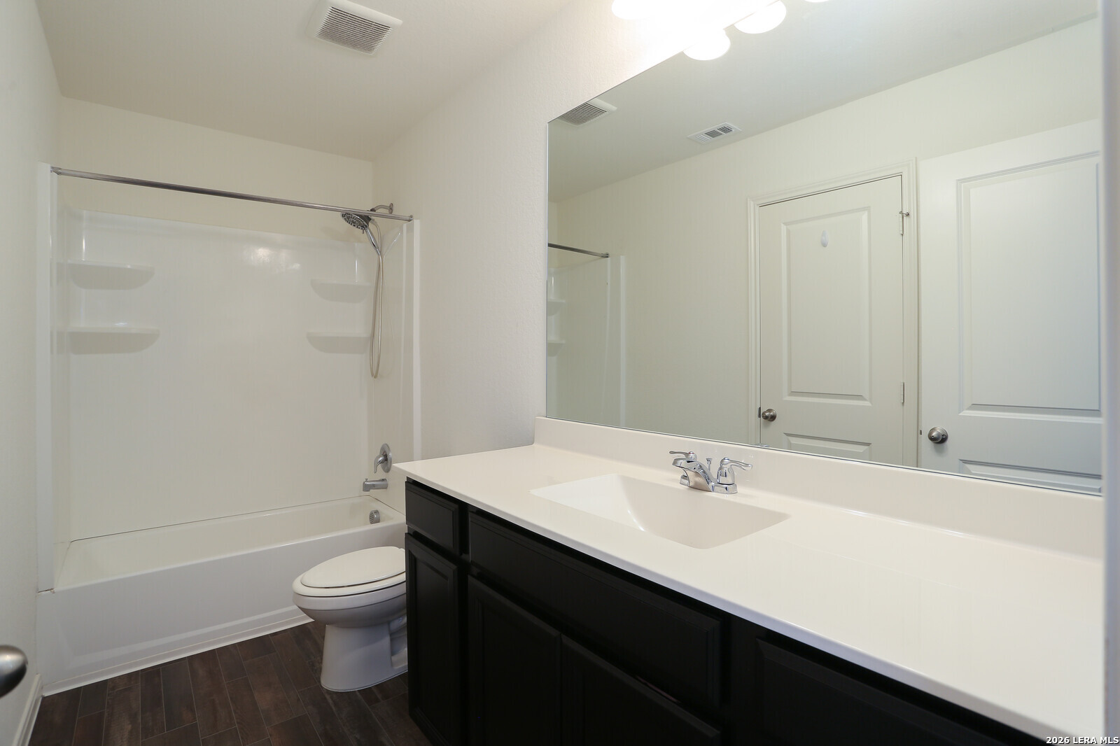 4913 Hallies Garden St. Hedwig, TX 78152 - Photo 15 of 23 a bathroom with a sink toilet and shower