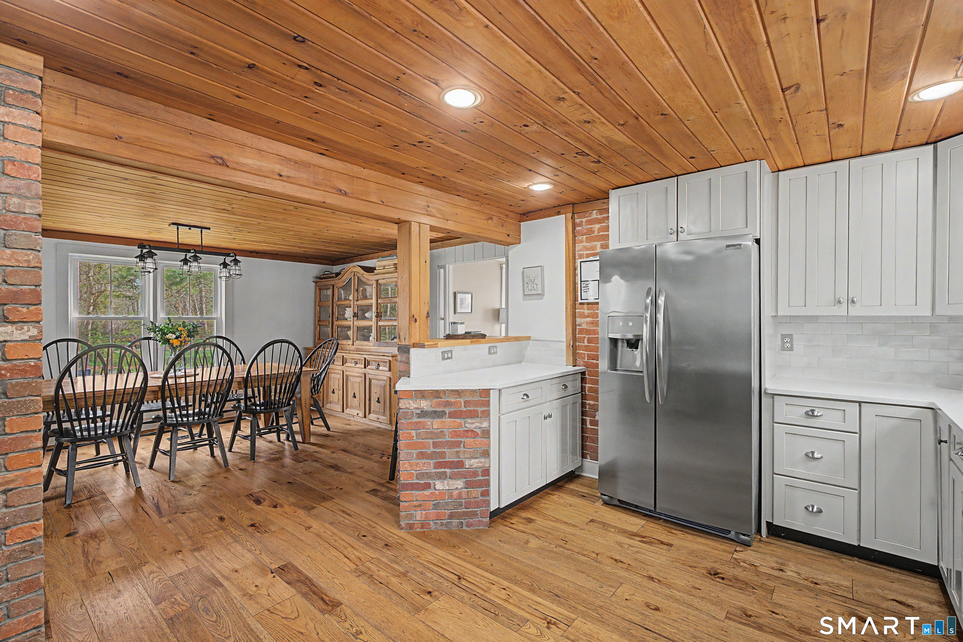 602 Durham Road Madison, CT 06443 - Photo 12 of 34 Exposed brick and breadboard completes this room
