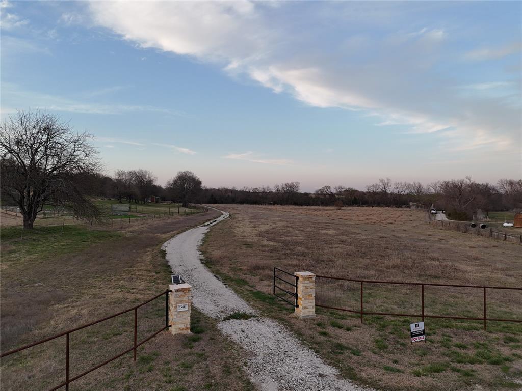 3891 Bethel-Cannon Road Van Alstyne, TX 75495 - Photo 2 of 16 a view of a lake with outdoor seating