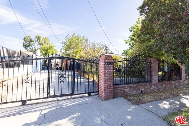 a view of a wrought iron fences in front of house