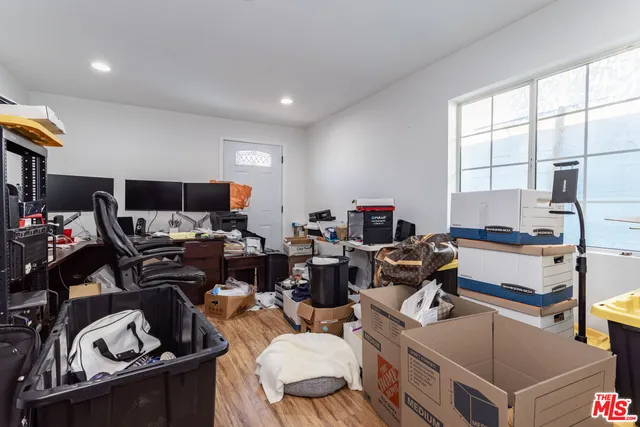 a room with gym equipment and a window